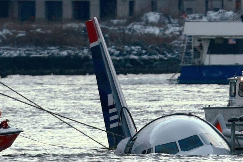  Rescue crews secure a US Airways flight 1549 floating in the water after it crashed into the Hudson River January 15, 2009 in New York City. The Airbus 320 craft crashed shortly after take-off from LaGuardia Airport heading to Charlotte, North Carolina. (Photo by Chris McGrath/Getty Images)
