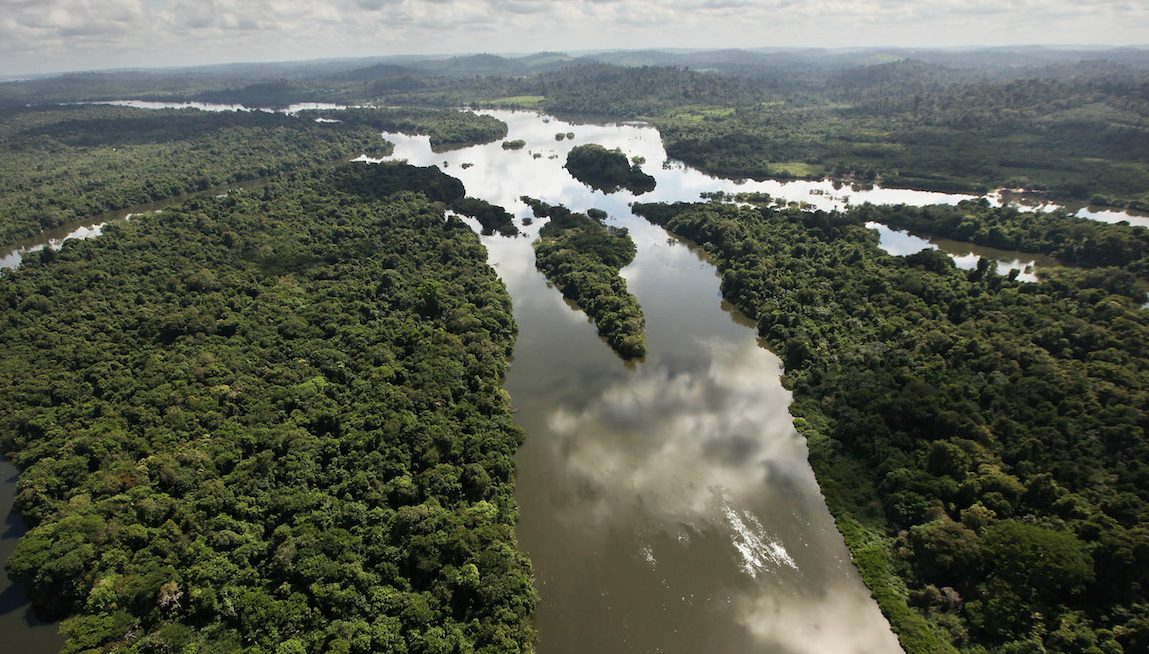 NEAR ALTAMIRA, BRAZIL - JUNE 15: The Xingu River flows near the area where the Belo Monte dam complex is under construction in the Amazon basin on June 15, 2012 near Altamira, Brazil. Belo Monte will be the world’s third-largest hydroelectric project and will displace up to 20,000 people while diverting the Xingu River and flooding as much as 230 square miles of rainforest. The controversial project is one of around 60 hydroelectric projects Brazil has planned in the Amazon to generate electricity for its rapidly expanding economy. While environmentalists and indigenous groups oppose the dam, many Brazilians support the project. The Brazilian Amazon, home to 60 percent of the world’s largest forest and 20 percent of the Earth’s oxygen, remains threatened by the rapid development of the country. The area is currently populated by over 20 million people and is challenged by deforestation, agriculture, mining, a governmental dam building spree, illegal land speculation including the occupation of forest reserves and indigenous land and other issues. Over 100 heads of state and tens of thousands of participants and protesters will descend on Rio de Janeiro, Brazil, later this month for the Rio+20 United Nations Conference on Sustainable Development or ‘Earth Summit’. Host Brazil is caught up in its own dilemma between accelerated growth and environmental preservation.   (Photo by Mario Tama/Getty Images)
