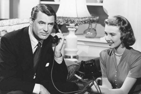 Dr. Madison Brown (Cary Grant) talks on the phone as Anabel Sims (Betsy Drake) sits beside him in a scene from the 1948 comedy Every Girl Should Be Married. (John Springer Collection/CORBIS/Corbis via Getty Images)