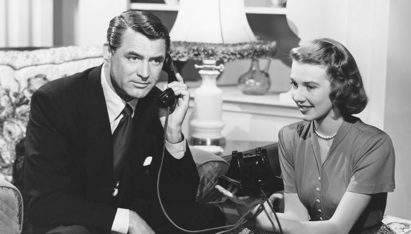 Dr. Madison Brown (Cary Grant) talks on the phone as Anabel Sims (Betsy Drake) sits beside him in a scene from the 1948 comedy Every Girl Should Be Married. (John Springer Collection/CORBIS/Corbis via Getty Images)