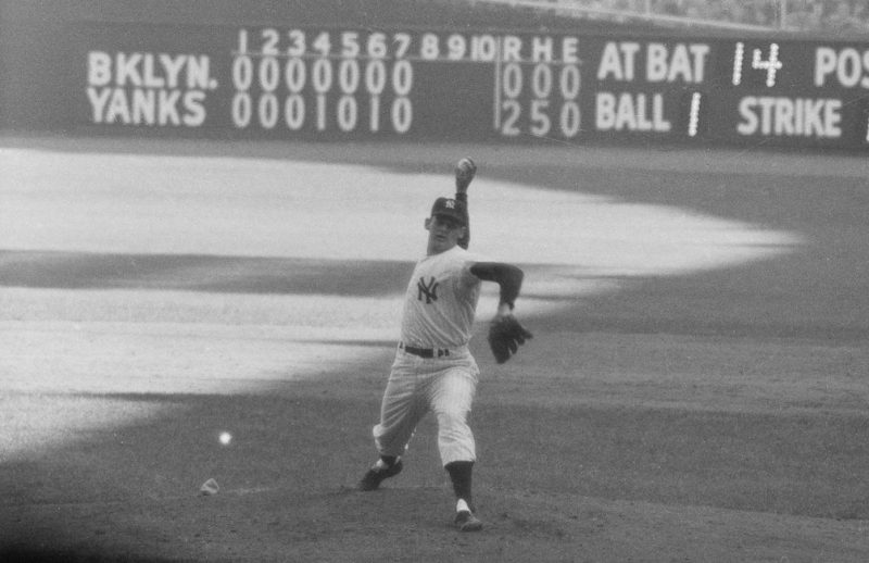 (Original Caption) The Writing on the Wall. New York: Yankee hurler Don Larsen studies the scoreboard at Yankee Stadium in the top of the 8th inning as he neared the feat of pitching the first perfect game in World Series history to give the Yankees a 2-0 victory over the Dodgers and a 3-to-2 game lead in the 1956 classic. The 27-year-old right hander threw only 97 pitches as he turned back 27 Dodgers in a row, seven of them on strikeouts. Larsen, who disdained any wind-up against the Dodgers, became the seventh man in all of baseball history to pitch a perfect game.