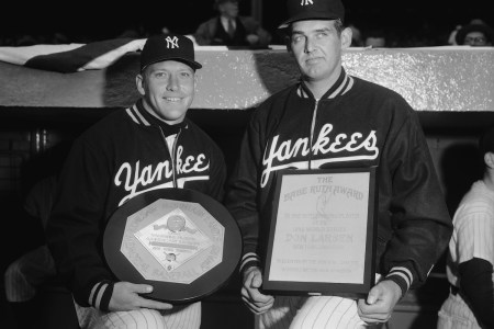 (Original Caption) Mickey Mantle, left, star center fielder of the New York Yankees and pitcher Don Larsen, also of the Yankees, are shown holding their awards they received before the opening day game at the Yankee Stadium today. Mickey is holding the Most Valuable Player award he won last year when he captured the Triple Crown of Baseball. Larsen displays his Babe Ruth award he received for his outstanding achievement in the World Series for pitching a perfect game against the Dodgers.