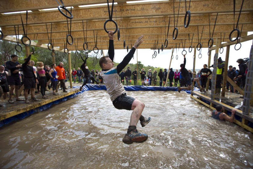 A participant traverses the hoops during the Tough Mudder endurance race in Henley on Thames, West of London, on April 26, 2014. T Justin Tallis/AFP/Getty Images)
