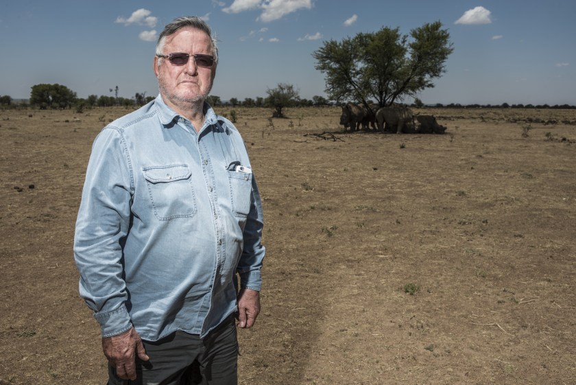 John Hume, hotel magnate and rhino farmer, poses for a photograph on his ranch outside Johannesburg, South Africa, on Friday, Dec. 4, 2015. White and black rhinos were brought back from the brink of extinction in South Africa in the 1960s to a stable population of close to 20,000. (Waldo Swiegers/Bloomberg via Getty Images)