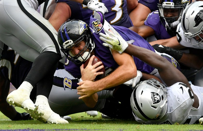 Joe Flacco #5 of the Baltimore Ravens scores a touchdown in the third quarter against the Oakland Raiders at M&T Bank Stadium on October 2, 2016 in Baltimore, Maryland. (Larry French/Getty Images)
