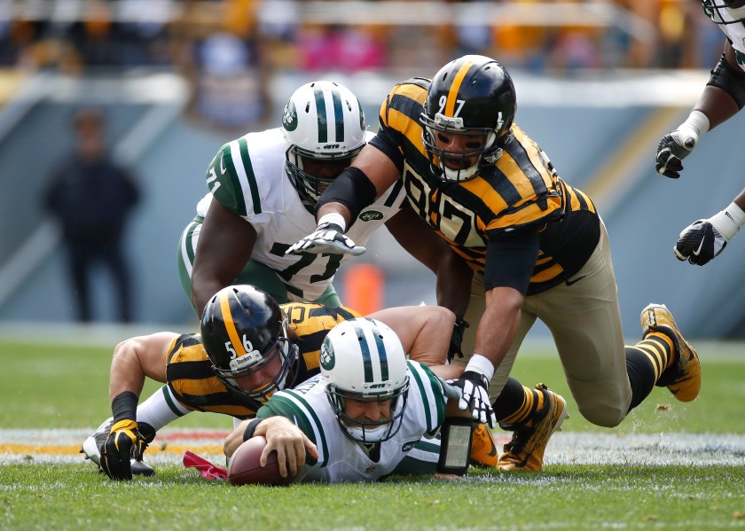 Ryan Fitzpatrick #14 of the New York Jets dives to recover a second quarter fumble under Anthony Chickillo #56 and Cameron Heyward #97 of the Pittsburgh Steelers at Heinz Field on October 9, 2016 in Pittsburgh, Pennsylvania. (Gregory Shamus/Getty Images)