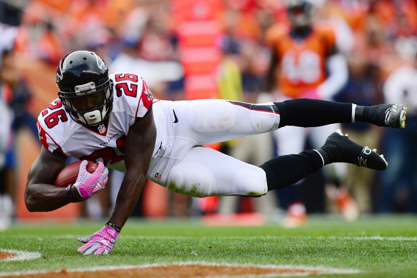 Running back Tevin Coleman #26 of the Atlanta Falcons dives for a touchdown in the third quarter of the game against the Denver Broncos at Sports Authority Field at Mile High on October 9, 2016 in Denver, Colorado. (Dustin Bradford/Getty Images)