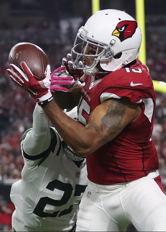 Wide receiver Michael Floyd #15 of the Arizona Cardinals makes a 9-yard touchdown reception against cornerback Darryl Roberts #27 of the New York Jets in the fourth quarter during the NFL game at the University of Phoenix Stadium on October 17, 2016 in Glendale, Arizona.  (Christian Petersen/Getty Images)