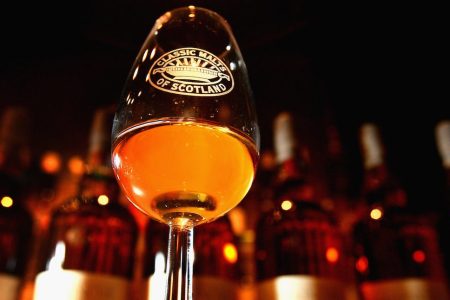 EDINBURGH, UNITED KINGDOM - MARCH 13: Andrew Kirk a malt advocate noses some whisky at Glenkinchie distillery March 13, 2008. Chancellor Alistair Darling has defended his decision to raise duty on whisky, for the first time in ten years. The Scottish Whisky Association say the rise has abandoned the government?s moves for a fairer alcohol tax policy.  (Photo by Jeff J Mitchell/Getty Images)