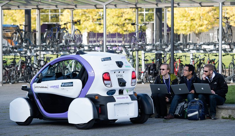 Technicans analise data follwong the trial of an autonomous self-driving vehicle in a pedestrianised zone, during a media event in Milton Keynes, north of London, on October 11, 2016. Driverless vehicles carrying passengers took to Britain's streets for the first time on Tuesday in a landmark trial which could pave the way for their introduction across the country. The compact two-seater cars trundled along a pedestrianised zone in Milton Keynes, north of London, in a trial by Transport Systems Catapult (TSC) which plans to roll out 40 vehicles in the city. / AFP / JUSTIN TALLIS (Photo credit should read JUSTIN TALLIS/AFP/Getty Images)