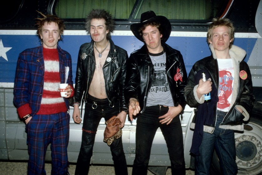The Sex Pistols pose for a portrait in front of their tour bus during the band's final tour. (Richard E. Aaron/Redferns)