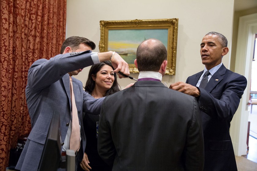 "Deputy National Security Advisor Ben Rhodes needed some assistance with his wardrobe so the President joined Brian Mosteller, Director of Oval Office Operations, and Personal Aide Ferial Govashiri in helping to spruce him up." (Official White House Photo by Pete Souza)