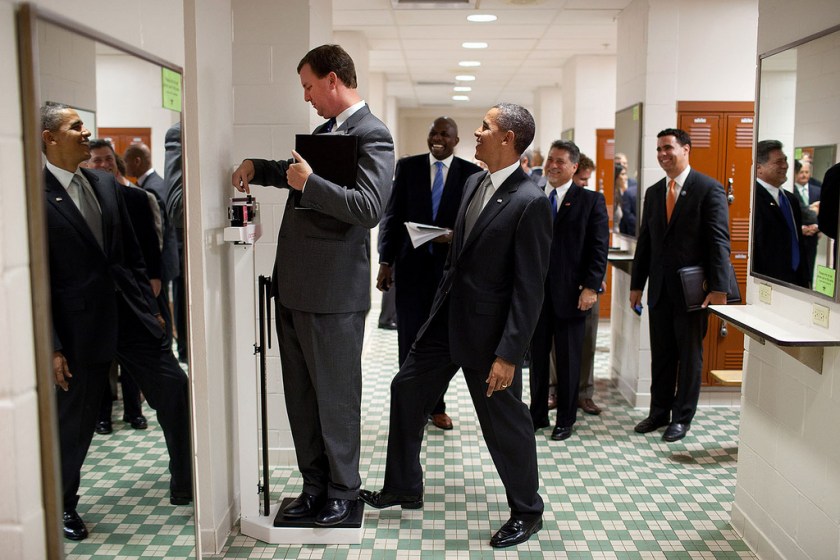 "We were walking through a locker room at the University of Texas when White House Trip Director Marvin Nicholson stopped to weigh himself on a scale. Unbeknownst to him, the President was stepping on the back of the scale, as Marvin continued to slide the scale lever. Everyone but Marvin was in on the joke." (Official White House Photo by Pete Souza)