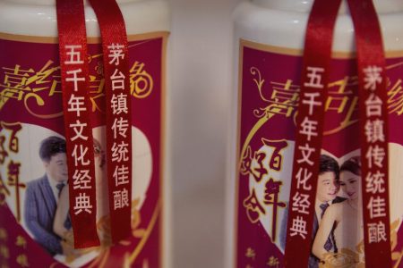 MAOTAI, CHINA - SEPTEMBER 22:  Bottles of locally made wine called baijiu are seen at a shop on the Chishui River on September 22, 2016 in Maotai,Guizhou province, China. Distillers in the famous Maotai town along the Chishui River produce well over half of the country's baijiu, the potent traditional Chinese wine made with fermented sorghum that is popular at state functions and often sells for hundreds of dollars per bottle. The most famous wine brands have long used the Chishui as their prime water source, giving the 437-kilometer long mainstream of the river a treasured reputation as being the "River of Wines". That the area is also revered as the site of a 1935 revolutionary battle led by Mao Zedong during the historic Long March of the Red Army has fortified efforts to protect the ecology of the Chishui and the river basin. This year, governments in the three provinces that the river crosses imposed strict measures to curb sewage disposal, over-development, and environmental degradation. As a result, the Chishui, which literally means "red water river' due to its reddish sentiment, is the only branch of the upper Yangtze that is not polluted, has no dams or reservoirs on its mainstream, and will eventually have a full ban on fishing. Authorities also closed nearly five hundred distilleries and paper mills. Major distillers dependent on the health of the "River of Wines" pay millions of dollars per year toward environmental maintenance and enforcement. (Photo by Kevin Frayer/Getty Images)