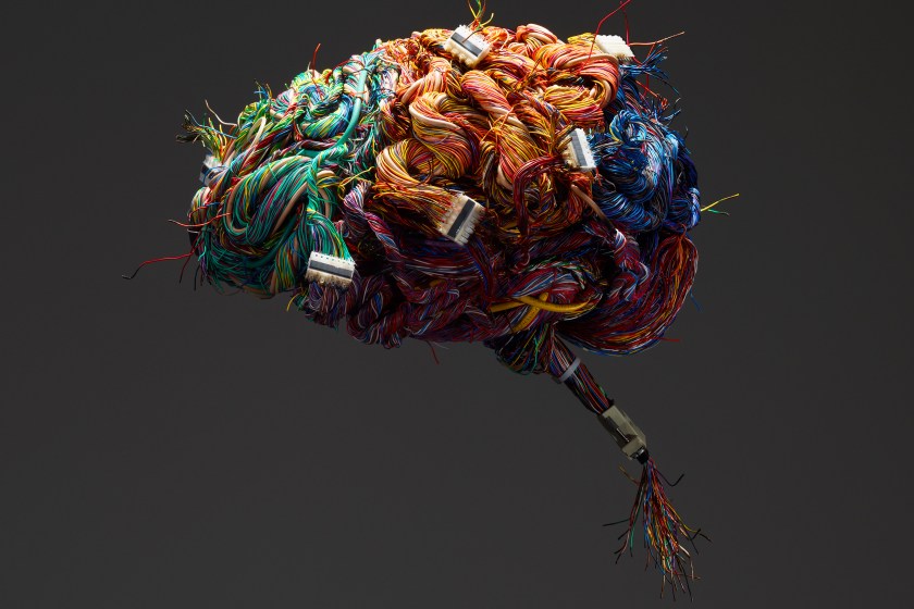 A model of the human brain constructed of wires and ports. (Getty Images)