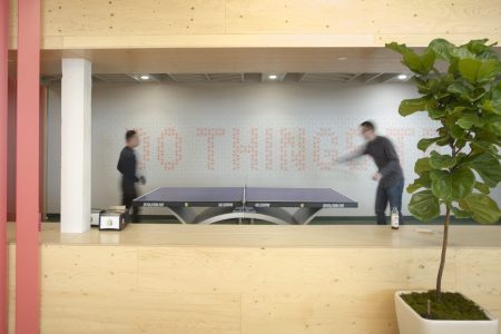 Employees of Shopify Inc. play ping-pong at their company's office space in Toronto, Ontario, Canada, on March 13, 2015. Rents for brick-and-beam real estate in the city's east end rose 26 percent to C$20.62 ($16.13) a square foot from 2007 and were up 49 percent in the west end, according to data compiled by CBRE Group Inc. (Kevin Van Paassen/Bloomberg via Getty Images)