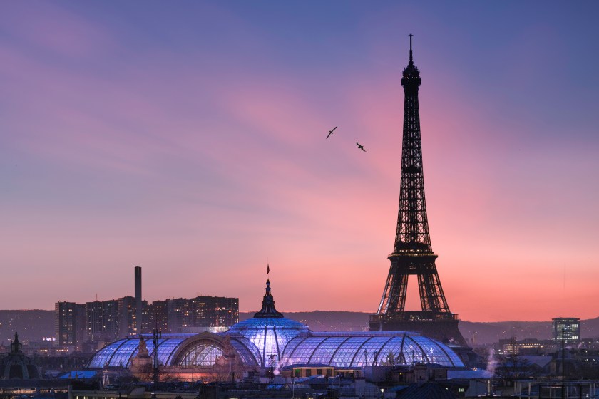 The Eiffel Tower at sunset, with the Grand Palais in the foreground (Getty Images)
