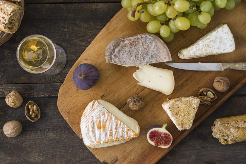 Cheese platter with camembert, walnut cheese, gorgonzola, taleggio and champagne