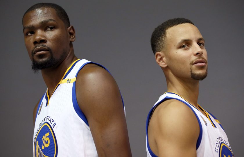Kevin Durant #35 and Stephen Curry #30 of the Golden State Warriors pose during the Golden State Warriors Media Day at the Warriors Practice Facility on September 26, 2016 in Oakland, California. (Ezra Shaw/Getty Images)