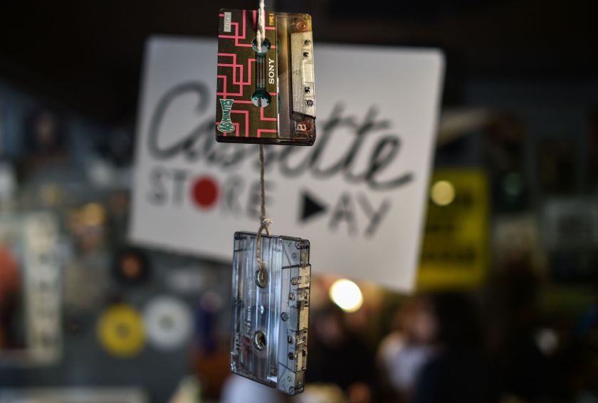 This picture taken on October 8, 2016 shows used audio cassettes hanging as decorations during "International Cassette Store Day" at the Teenage Head Records store in Subang Jaya, on the outskirts of Kuala Lumpur. Vinyl's renaissance is well-documented and now it seems cassettes are rising from the grave, with artists such as Kanye West and Justin Bieber releasing songs on tape. In Southeast Asia low production costs and a retro-cool image have made cassettes an underground-music fixture, especially for struggling bands getting their name out. (Mohd Rasfan/AFP/Getty Images)
