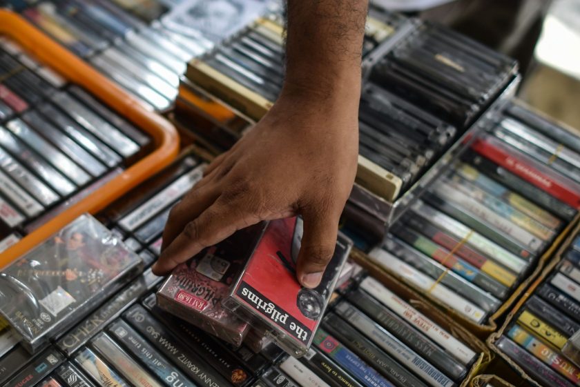 This picture taken on October 8, 2016 shows a collector browsing audio cassettes during "International Cassette Store Day" in Subang Jaya, on the outskirts of Kuala Lumpur. Vinyl's renaissance is well-documented and now it seems cassettes are rising from the grave, with artists such as Kanye West and Justin Bieber releasing songs on tape. In Southeast Asia low production costs and a retro-cool image have made cassettes an underground-music fixture, especially for struggling bands getting their name out. (Mohd Rasfan/AFP/Getty Images)