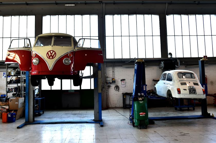 In addition to the vintage Volkswagens seen at left, the "T1 specialist" team also restores other cars, such as the Fiat500 on the right. (Alberto Pizzoli/AFP/Getty Images)