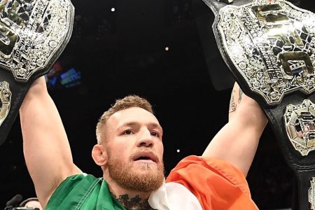 UFC lightweight and featherweight champion Conor McGregor of Ireland celebrates after defeating Eddie Alvarez in their UFC lightweight championship fight during the UFC 205 event at Madison Square Garden on November 12, 2016 in New York City. (Jeff Bottari/Zuffa LLC/Zuffa LLC via Getty Images)