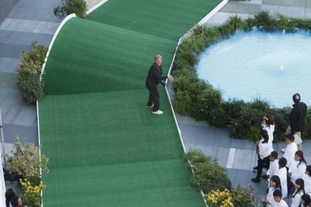 PGA Tour profesional Fred Couples raises his arms but fails to make a hole in one at a minigolf course on the plaza at LA Live on Novmber 11, 2010. An urban golf event involved sixth grade math students in Teach For America from Stephenson Middle School in E. Los Angeles and the students were rewarded for their hard work in mathematics with the funfilled golf experience. The event celebrates the upcoming Chevron World Challenge, a PGA Tour cosponsored event and the World Challenge features 18 of the world's best golfers and benefits educationfocused nonprofits. If Couples made the hole in one, then Chevron would have donated $15,000 to the education nonprofit partners. LA Live plaza was transformed on Thursday (one day only) into a picturesque urban minigolf oasis complete wth a 9hole course, sand trap, pro shop and clubhouse. Couples also gave golf pointers to the students.  (Photo by Gary Friedman/Los Angeles Times via Getty Images)