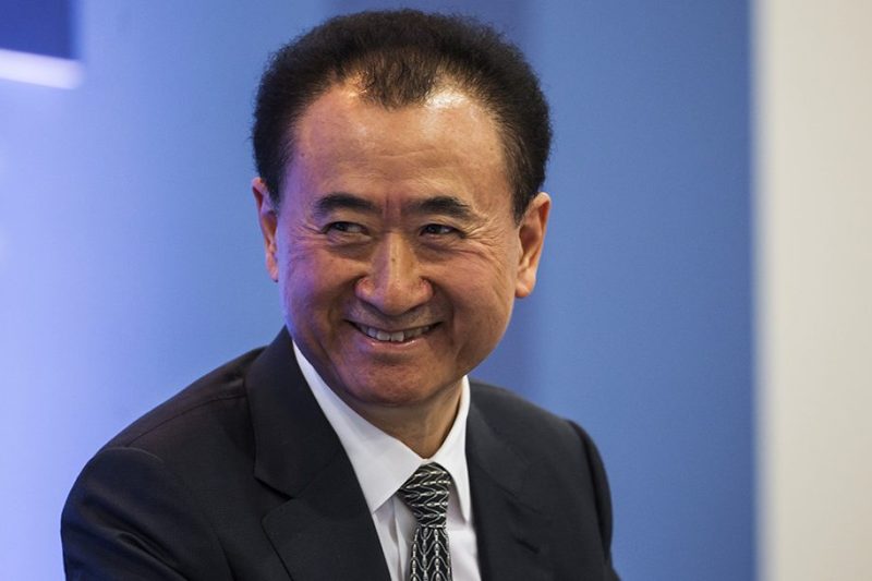 Billionaire Wang Jianlin, chairman and president of Dalian Wanda Group Co., reacts during the Hong Kong Asian Financial Forum (AFF) in Hong Kong, China, on Monday, Jan. 18, 2016. Dalian Wanda Group, the property-to-entertainment conglomerate headed by Asia's richest man, is planning five 'substantial' acquisitions this year as the company braces for a drop in sales. Photographer: Justin Chin/Bloomberg via Getty Images