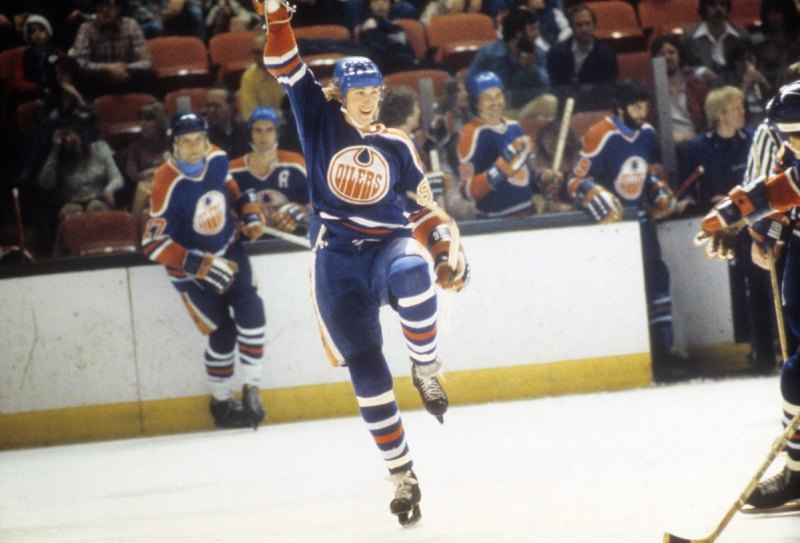 HARTFORD, CT - APRIL, 1979: Wayne Gretzky #99 of the Edmonton Oilers celebrates a goal during a WHA game against the New England Whalers in April, 1979 at the Hartford Civic Center in Hartford, Connecticut. (Photo by B Bennett/Bruce Bennett Studios/Getty Images)