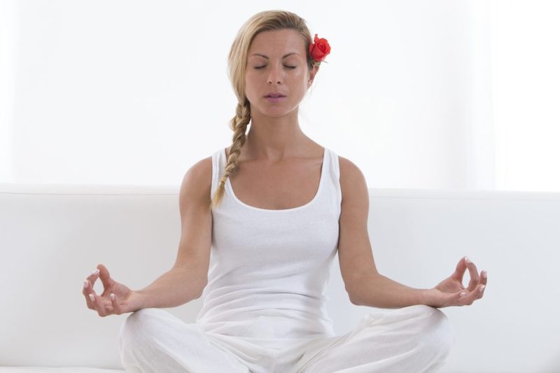 Woman meditating (Photo by: BSIP/UIG via Getty Images)