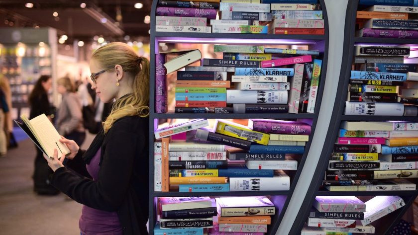 FRANKFURT AM MAIN, GERMANY - OCTOBER 15: A woman reads a book at the 2015 Frankfurt Book Fair (Frankfurter Buchmesse) on October 15, 2015 in Frankfurt am Main, Germany. The 2015 fair, which is among the world's largest book fairs, will be open to the public from October 13-18. (Photo by Thomas Lohnes/Getty Images)