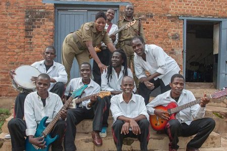 Members of Malawi's Zomba Prison Project band pose for a photograph outside the Central Prisons makeshift music studio at the end of a rehearsal on January 8, 2016 in Zomba, Malawi. (AMOS GUMULIRA/AFP/Getty Images)