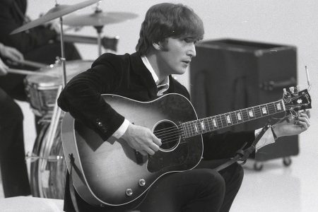 UNSPECIFIED - CIRCA 1960:  Photo of BEATLES and John LENNON; of the Beatles, tuning guitar (Gibson J160E acoustic) during the filming of "A Hard Day's Night" at the Scala Theatre  (Max Scheler - K & K/Redferns)