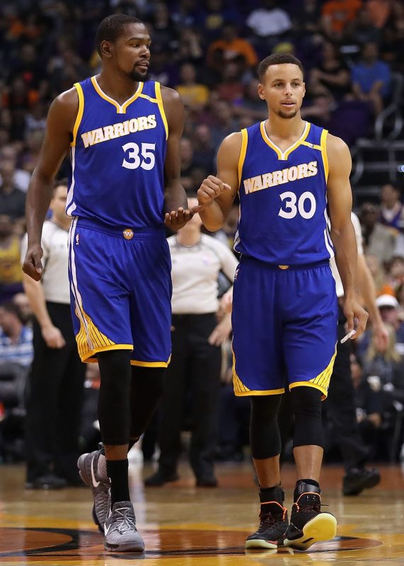 Kevin Durant #35 and Stephen Curry #30 of the Golden State Warriors  (Photo by Christian Petersen/Getty Images)