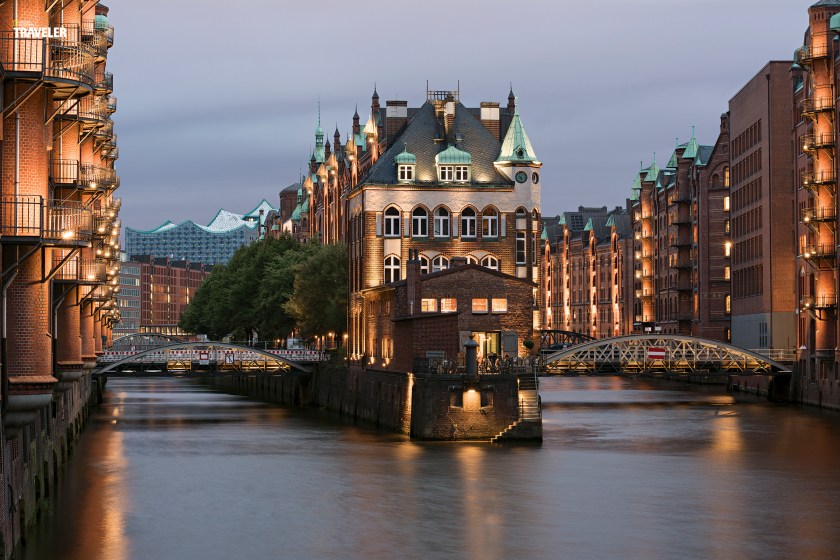 Historic warehouses in Hamburg’s Speicherstadt district are best viewed on a canal cruise. (Courtesy National Geographic Traveler)