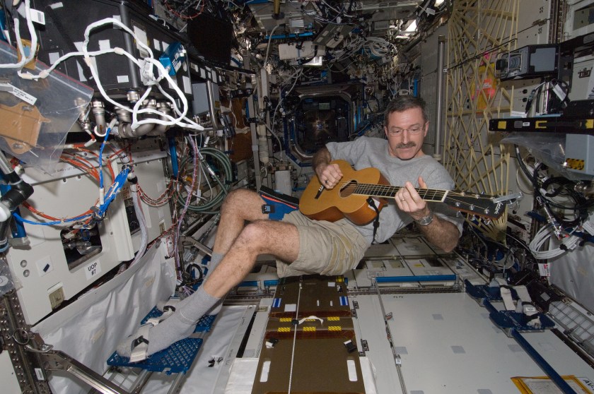  NASA astronaut Dan Burbank, Expedition 30 commander, plays a guitar in the Destiny laboratory of the International Space Station in 2012. (NASA)