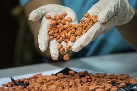 A Bureau of Customs (BOC) personnel displays confiscated illegal drugs, known Methylenedioxymethamphetamine (MDMA), commonly refered to as ecstasy, at a press conference at the BOC headquarters in Manila on September 14, 2016. / AFP / NOEL CELIS        (Photo credit should read NOEL CELIS/AFP/Getty Images)