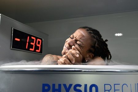 France's midfielder Elodie Thomis reacts as she undergoes treatment in a medical device used for cryotherapy at the French national football team training base in Clairefontaine-en-Yvelines, on May 11, 2015, during preparations for the upcoming FIFA 2015 Women's World Cup. AFP PHOTO / FRANCK FIFE

--FRANCE OUT--        (Photo credit should read FRANCK FIFE/AFP/Getty Images)