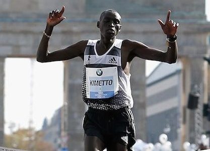 BERLIN, GERMANY - SEPTEMBER 28:  Dennis Kimetto of Kenya crosses the finish line in new world record time during the 41th BMW Berlin Marathon on September 28, 2014 in Berlin, Germany.  (Photo by Boris Streubel/Bongarts/Getty Images)