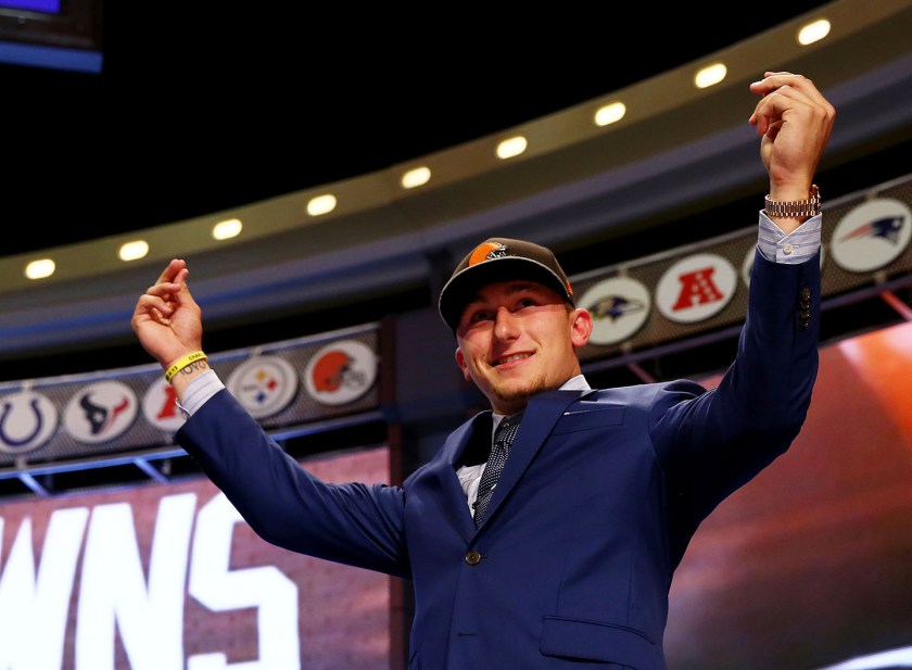 Johnny Manziel of the Texas A&M Aggies takes the stage after he was picked #22 overall by the Cleveland Browns during the first round of the 2014 NFL Draft at Radio City Music Hall on May 8, 2014 in New York City. (Elsa/Getty Images)