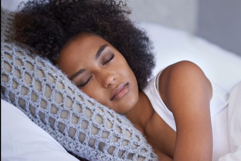 Cropped shot of a young woman asleep on her side (PeopleImages)