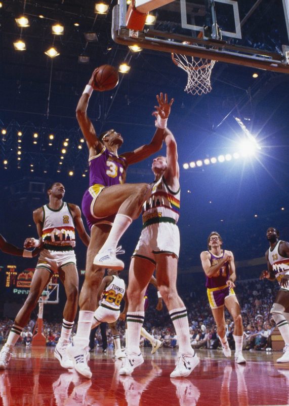 Los Angeles Lakers' center Kareem Abdul-Jabbar #33 jumps for a layup during a game against the Denver Nuggets circa the 1980's in Denver, Colorado. (Focus on Sport/Getty Images)