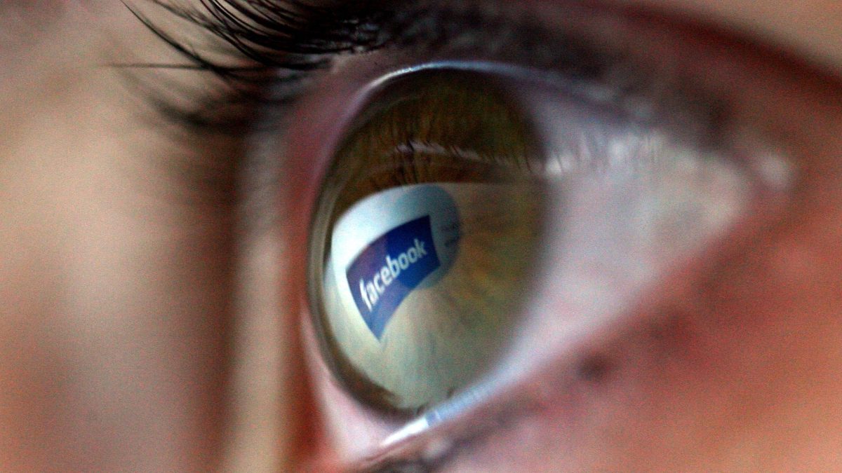 Facebook logo is reflected in the eye of a girl (Chris Jackson/Getty Images)