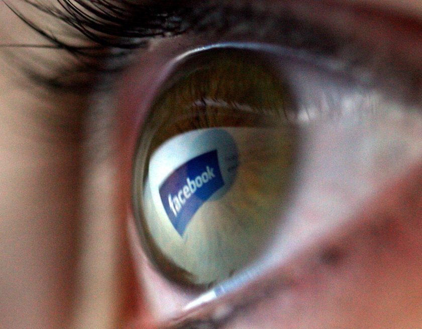 Facebook logo is reflected in the eye of a girl (Chris Jackson/Getty Images)