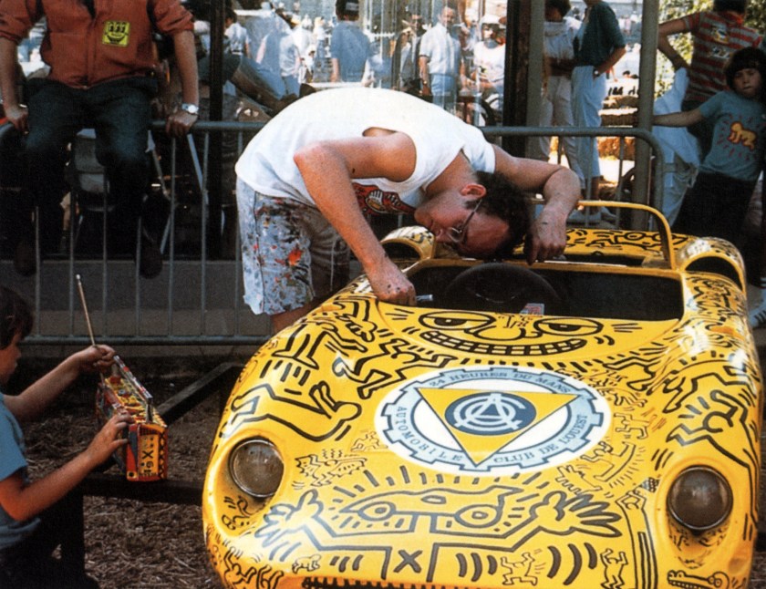 Haring working on the 1962 SCAF/Mortarini Mini Ferrari 330 P-2 at Le Mans (Keith Haring Foundation/Petersen Automotive Museum)
