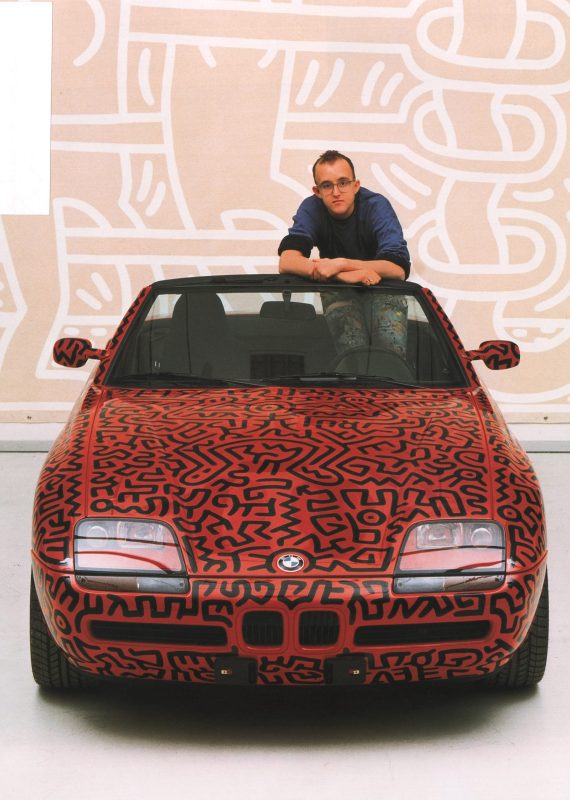 Haring posing with the 1991 BMW Z1 (Keith Haring Foundation/Petersen Automotive Museum)