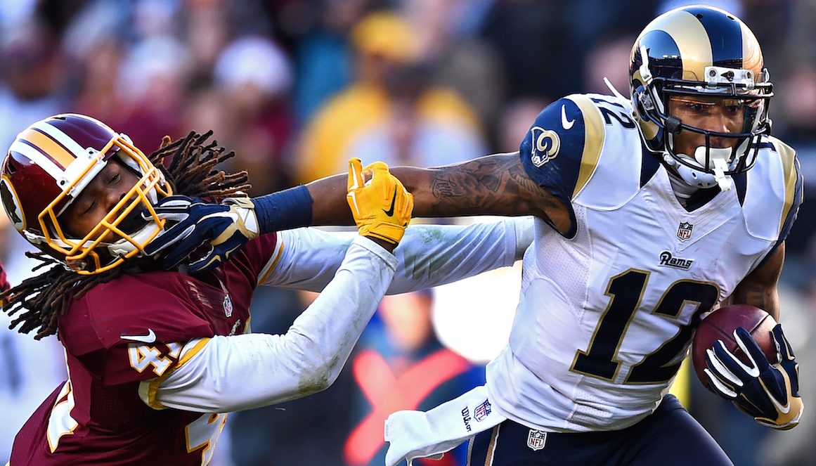 LANDOVER, MD - DECEMBER 07: Strong safety Phillip Thomas #41 of the Washington Redskins is stiff armed by wide receiver Stedman Bailey #12 of the St. Louis Rams in the third quarter of a game at FedExField on December 7, 2014 in Landover, Maryland. (Photo by Patrick Smith/Getty Images)