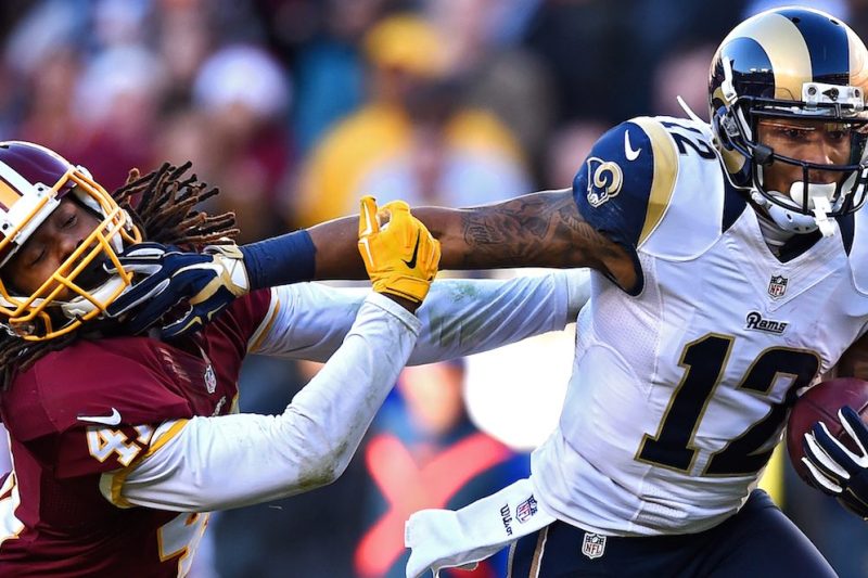 LANDOVER, MD - DECEMBER 07: Strong safety Phillip Thomas #41 of the Washington Redskins is stiff armed by wide receiver Stedman Bailey #12 of the St. Louis Rams in the third quarter of a game at FedExField on December 7, 2014 in Landover, Maryland. (Photo by Patrick Smith/Getty Images)