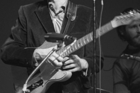 Guitarist Robbie Robertson and drummer Levon Helm of The Band perform during a concert at Queens College in New York. (Photo by Harvey L. Silver/Corbis via Getty Images)